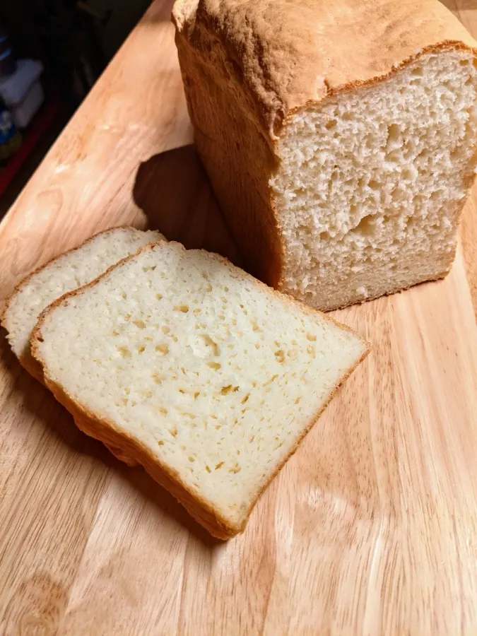 Sandwich loaf cut on a wooden board